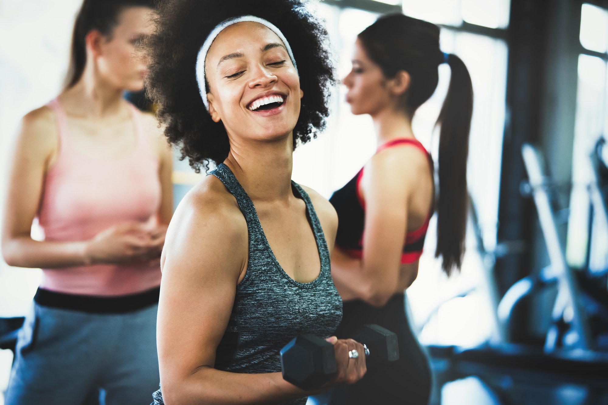 Picture of cheerful fit fitness team in gym